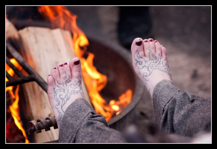 Inked Feet around the fire.