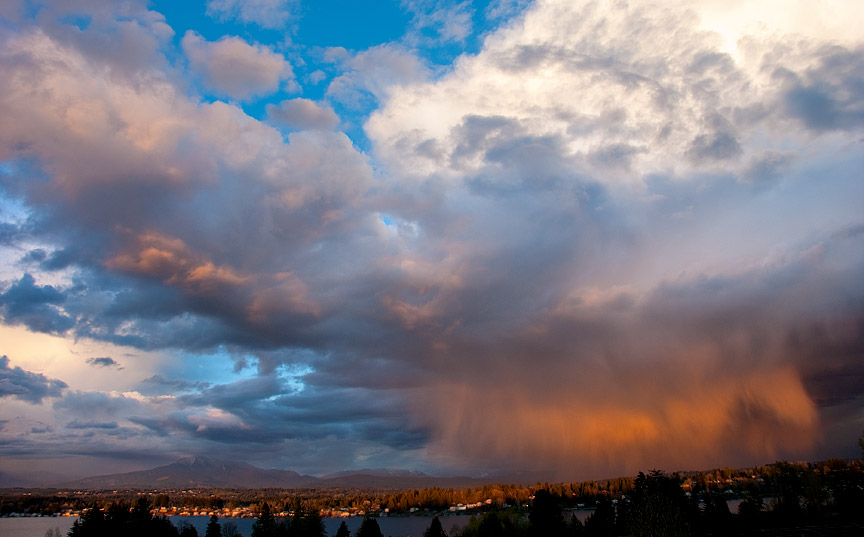 Rain and clouds highlighted by the evening sun, Lake Stevens, WA.