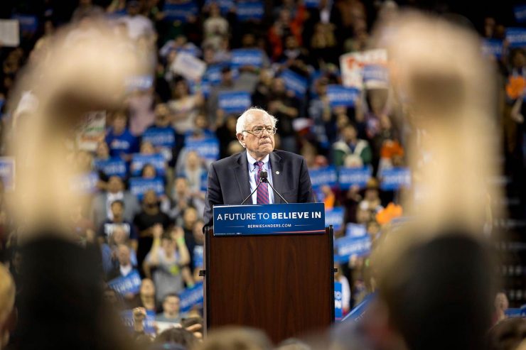 bernie-sanders-framed-by-raised-arms