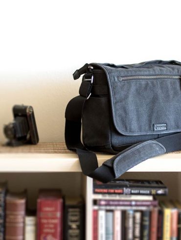 Tenba Cooper Series 13 DSLR Bag on book case.