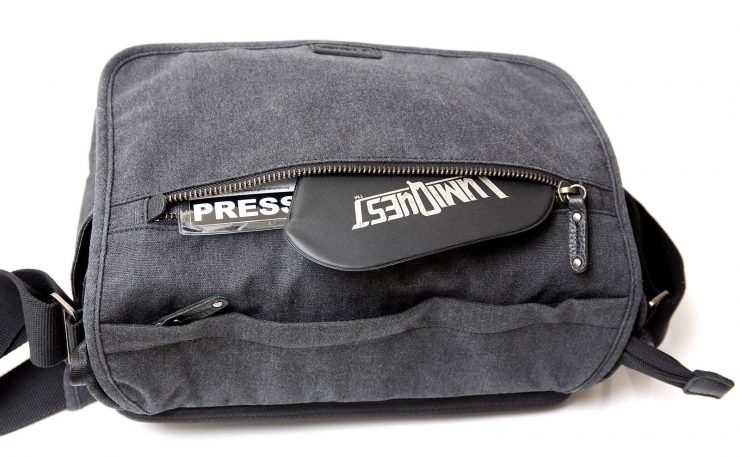 Cooper 13 DSLR front flap zipper pocket with press credentials and flash bounce.
