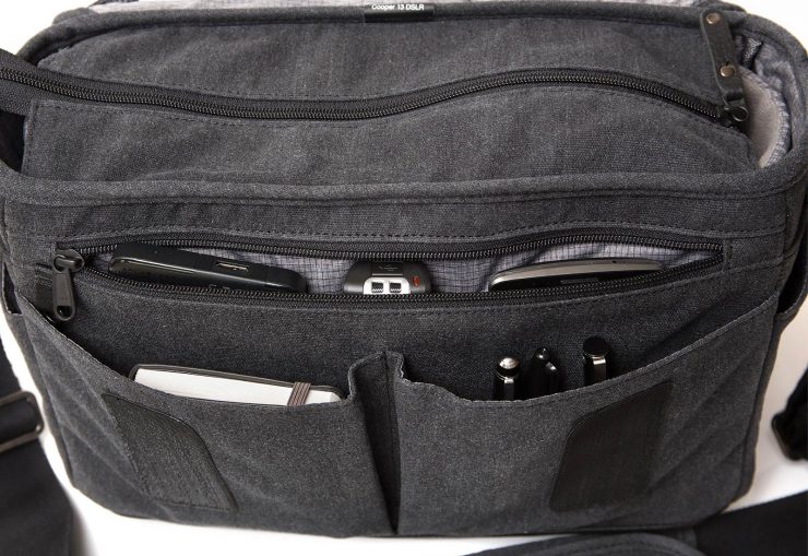 The front pockets of the Cooper 13 loaded with pens, notebook, hard-drive, recorder, and phone.
