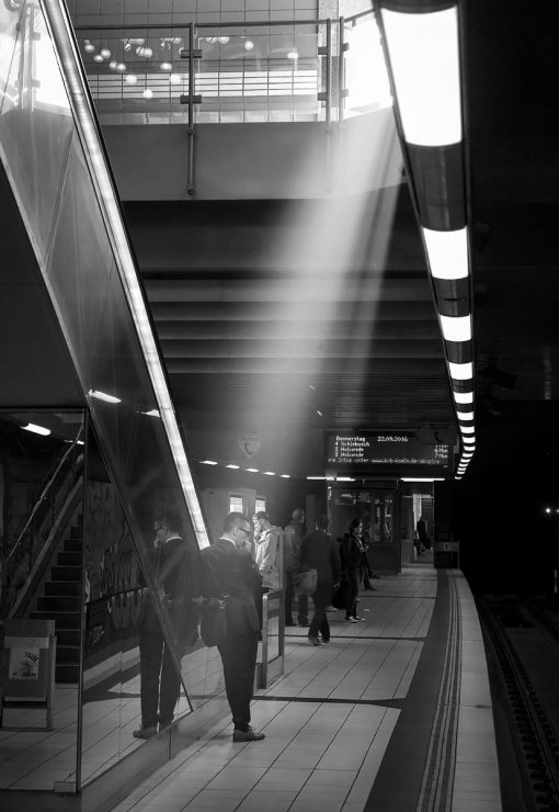 A shaft of sunlight pours down into the subway station at the Piusstraße U-bahn station. 