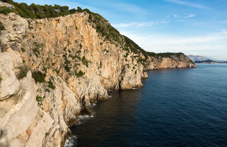 Coastal cliffs in the Park šuma Velika i Mala Petka, Dubrovnik, Croatia. I just noticed that my shadow is visible in the lower left corner.