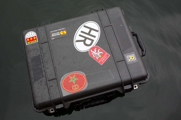 Pelican case floating in water.