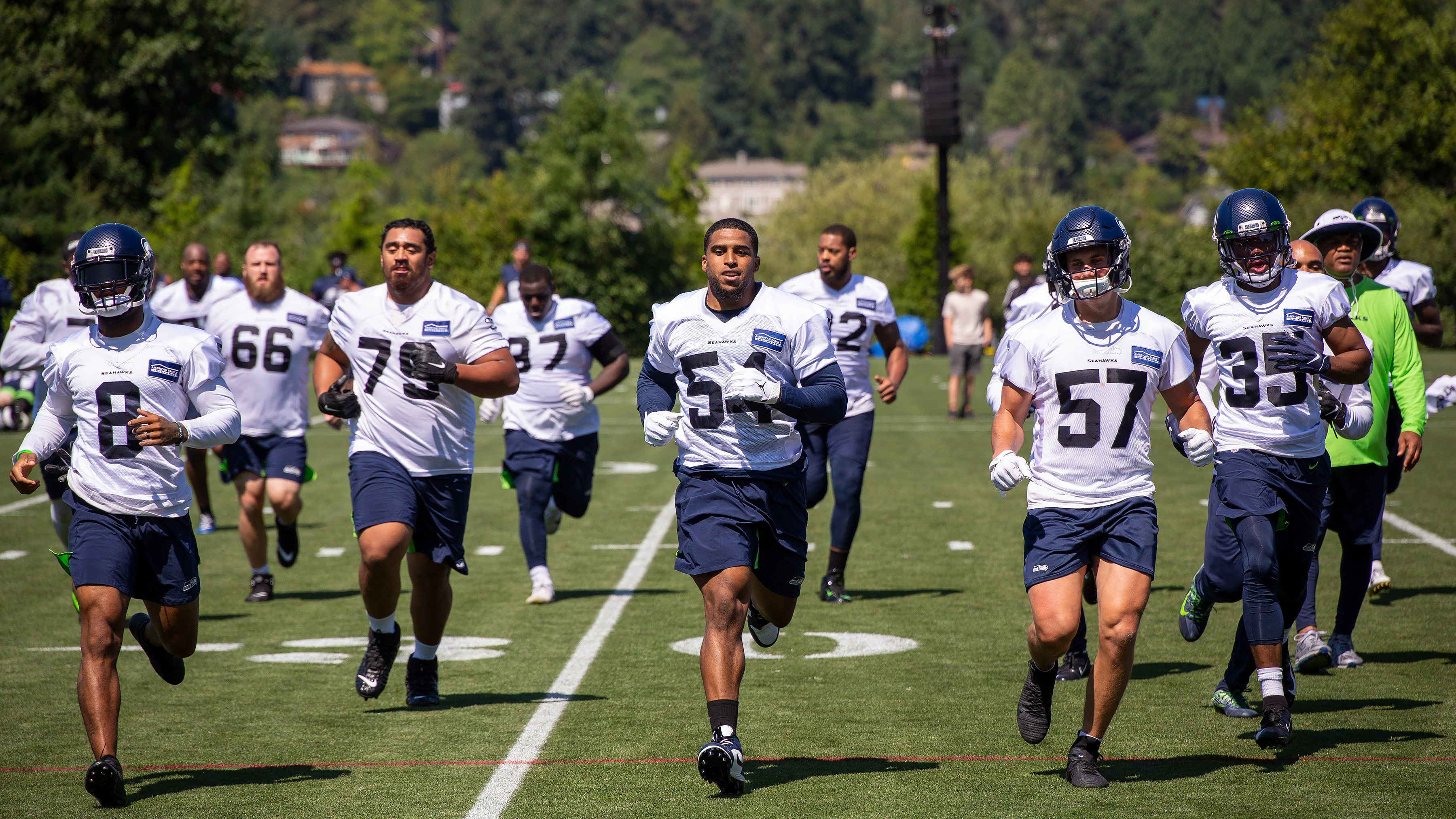 Seattle Seahawks players running at the VMAC