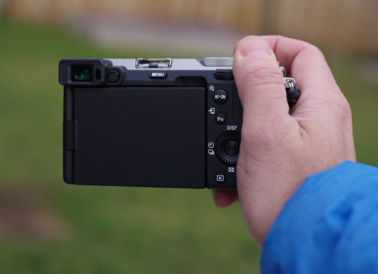 The Sony A7C in the hand