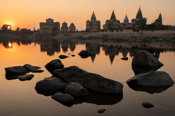 Orchha, India temples reflected in river